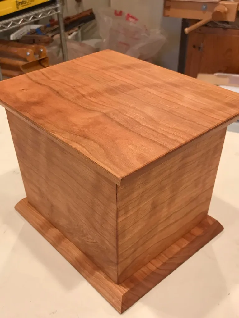 Handmade cherry wood urn with a lifting lid, built in Baltimore by Tyler Jones