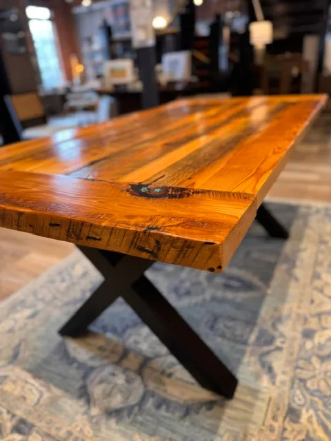 Reclaimed wood farmhouse dining table with a black X base, built to order in Baltimore